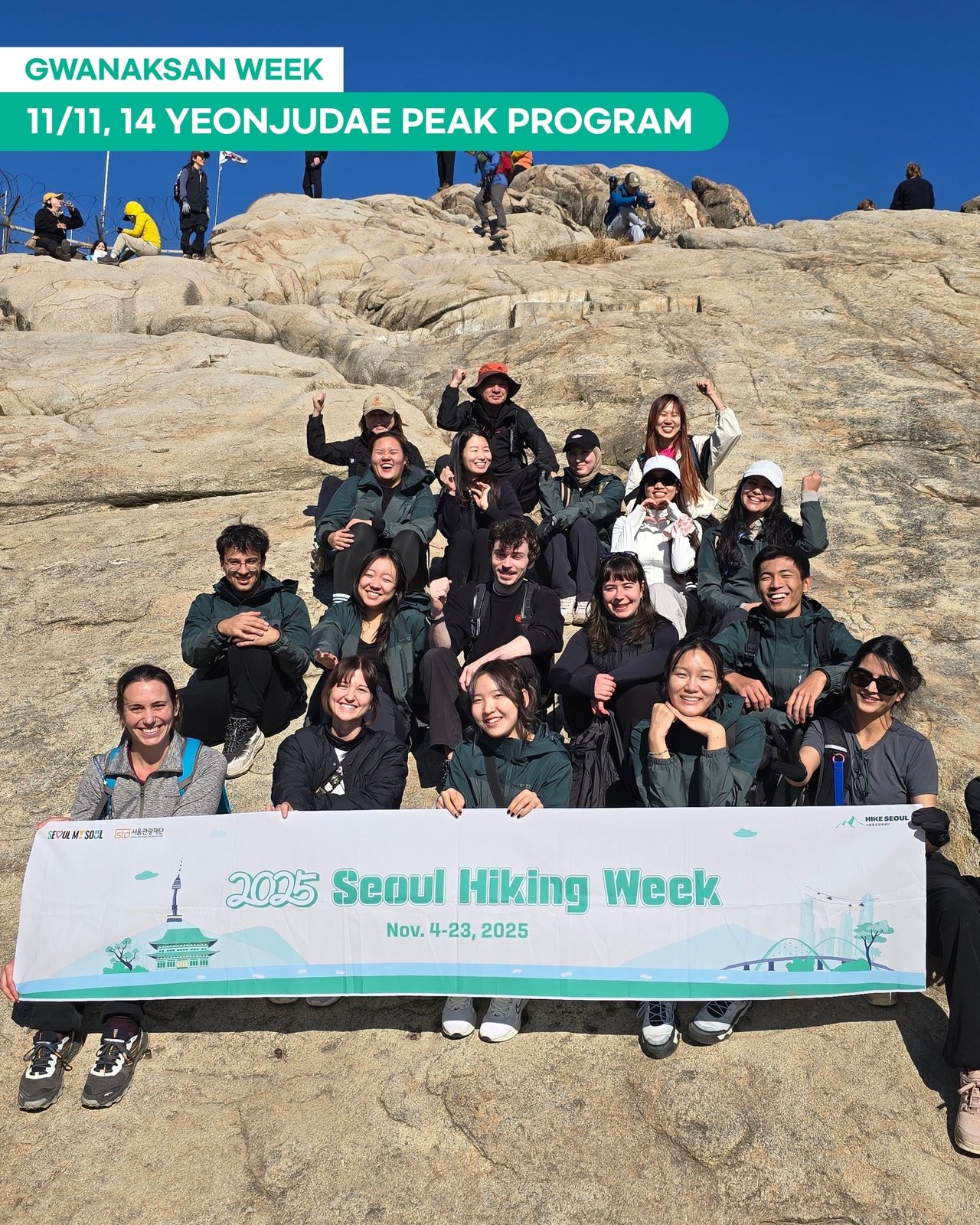 Participants of a group hiking program offered by Seoul Tourism Hiking Center pose at Yeonjudae Peak on Gwanaksan in Seoul on Nov. 11. (Seoul Tourism Organization)